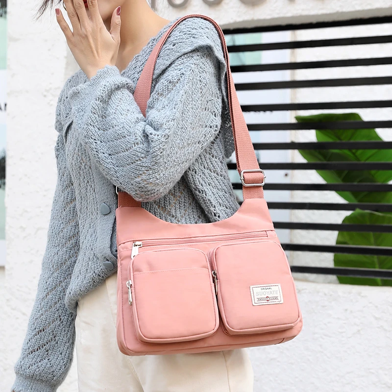 Fashion Waterproof Nylon Shoulder Bags For Women 2021 Brand Small Luxury Handbags Multi-pocket Solid Color Travel Messenger Bag
Fashion Waterproof Nylon Shoulder Bags For Women 2021 Brand Small Luxury Handbags Multi-pocket Solid Color Travel Messenger Bag