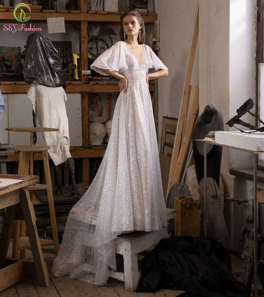 SSYFashion New White Sequins Evening Dress for Women Sexy V-neck Backless Lotus Leaf Sleeve Long Prom Formal Gowns Vestidos
SSYFashion New White Sequins Evening Dress for Women Sexy V-neck Backless Lotus Leaf Sleeve Long Prom Formal Gowns Vestidos