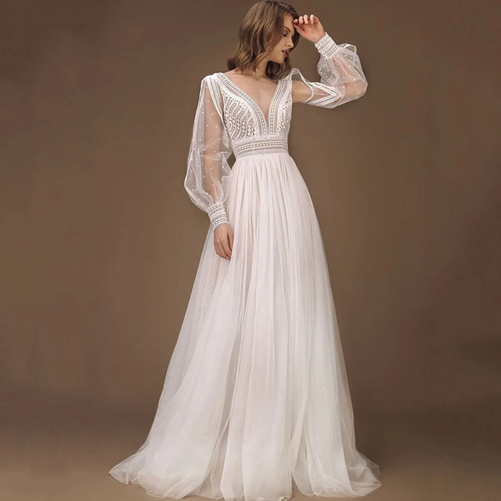Elegant Wedding Dresses Tulle Illusion Lace Pearls V-Neck Floor-Length Backless Full Sleeve Ball Bridal Gowns
Elegant Wedding Dresses Tulle Illusion Lace Pearls V-Neck Floor-Length Backless Full Sleeve Ball Bridal Gowns