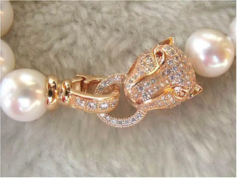 18" AAA++ 10-9MM GENUINE WHITE AKOYA PEARL NECKLACE LEOPARD HEAD CLASP 
18" AAA++ 10-9MM GENUINE WHITE AKOYA PEARL NECKLACE LEOPARD HEAD CLASP