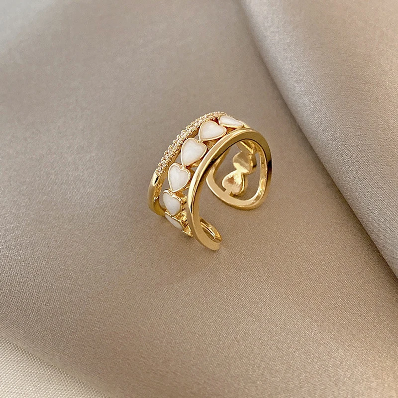 Korean version of the fashion personality metal inlaid diamond white shell love ring female retro simple opening ring
Korean version of the fashion personality metal inlaid diamond white shell love ring female retro simple opening ring