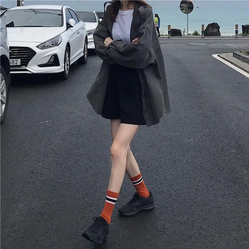 Autumn tooling style long sleeve windbreaker new versatile medium length coat loose and thin solid color Korean style top woman 
Autumn tooling style long sleeve windbreaker new versatile medium length coat loose and thin solid color Korean style top woman