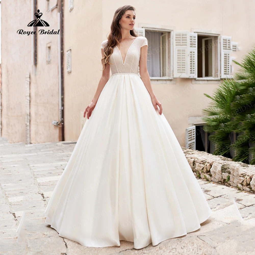 Elegant Ivory Illusion V-Neck Wedding Dress Cap Sleeves Bridal Gown With Glitter Tulle Sexy Backless Beading Brides Dresses
Elegant Ivory Illusion V-Neck Wedding Dress Cap Sleeves Bridal Gown With Glitter Tulle Sexy Backless Beading Brides Dresses