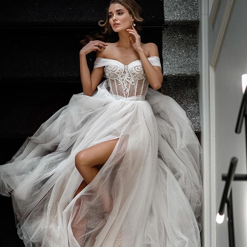 2023 Sexy Beach Wedding Dresses Lace Beads Bride Dress Off Shoulder Glitter Tulle Split Side Boho Long Train Boda Wedding Gowns
2023 Sexy Beach Wedding Dresses Lace Beads Bride Dress Off Shoulder Glitter Tulle Split Side Boho Long Train Boda Wedding Gowns