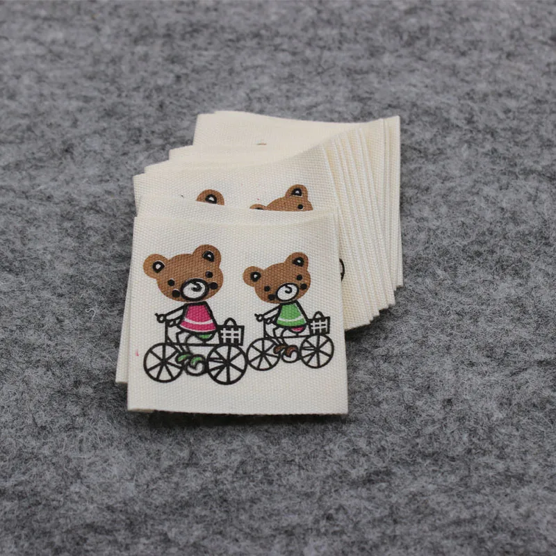stock natural white cotton printed label/main label for kids clothing/garment tag printing/collar label
stock natural white cotton printed label/main label for kids clothing/garment tag printing/collar label