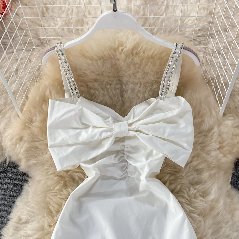 Bowknot white date sling dress summer new style French temperament was thin first love white skirt short skirt 
Bowknot white date sling dress summer new style French temperament was thin first love white skirt short skirt