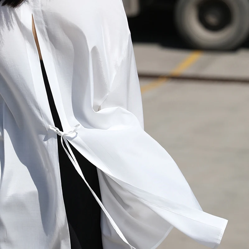 TWOTWINSTYLE back lace up bowknot blouse for female lapel collar long sleeve loose pure color women's casual shirt 2021 new
TWOTWINSTYLE back lace up bowknot blouse for female lapel collar long sleeve loose pure color women's casual shirt 2021 new