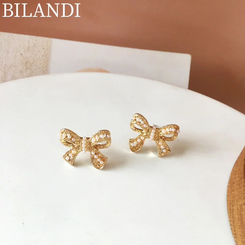Bilandi S925 needle Sweet Jewelry Bow Earrings Sweet Design Simulated Pearl Women Stud Earrings For Girl Fine Accessories
Bilandi S925 needle Sweet Jewelry Bow Earrings Sweet Design Simulated Pearl Women Stud Earrings For Girl Fine Accessories