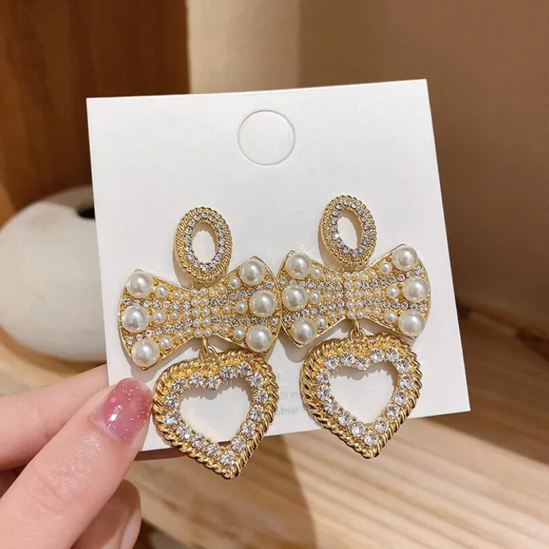 925 Silver needle European and American fashion exaggeration set diamond bow heart earrings retro court style earrings personali
925 Silver needle European and American fashion exaggeration set diamond bow heart earrings retro court style earrings personali