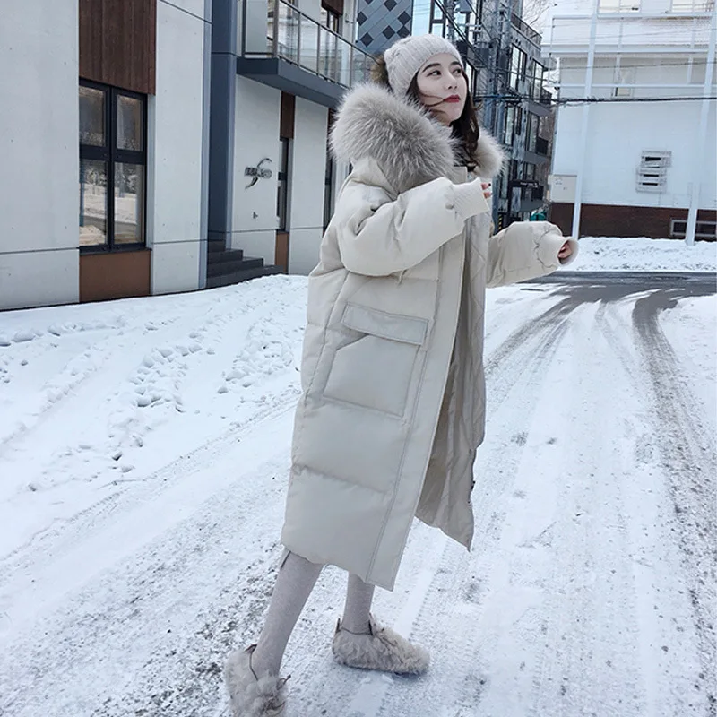 2021 Down Jacket Women Big Fur Collar Design Korean Style Popular Mid-length Hooded Cotton Warm Jacket for Women 
2021 Down Jacket Women Big Fur Collar Design Korean Style Popular Mid-length Hooded Cotton Warm Jacket for Women