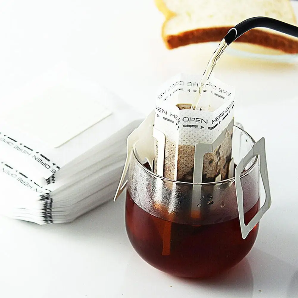 50Pcs/pack Portable Hanging Ear Style Coffee Filters Disposable Coffee Fliter Bags Eco-Friendly Paper Bag for Espresso Coffee
50Pcs/pack Portable Hanging Ear Style Coffee Filters Disposable Coffee Fliter Bags Eco-Friendly Paper Bag for Espresso Coffee