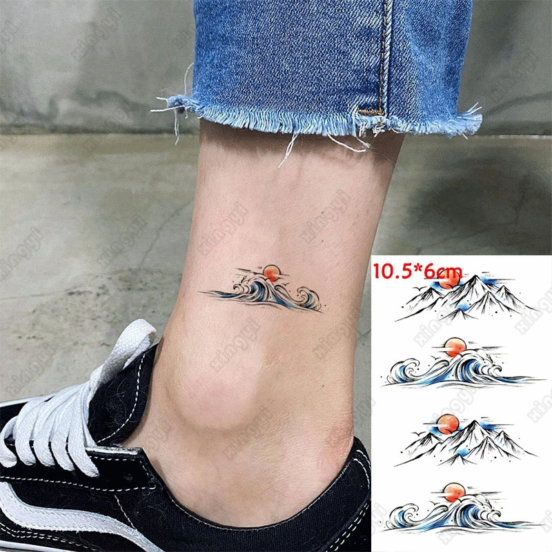 Водостойкая временная татуировка-наклейка с рисунком волн, восхода и гор, искусственная татуировка на запястье для мужчин и женщин
Водостойкая временная татуировка-наклейка с рисунком волн, восхода и гор, искусственная татуировка на запястье для мужчин и женщин