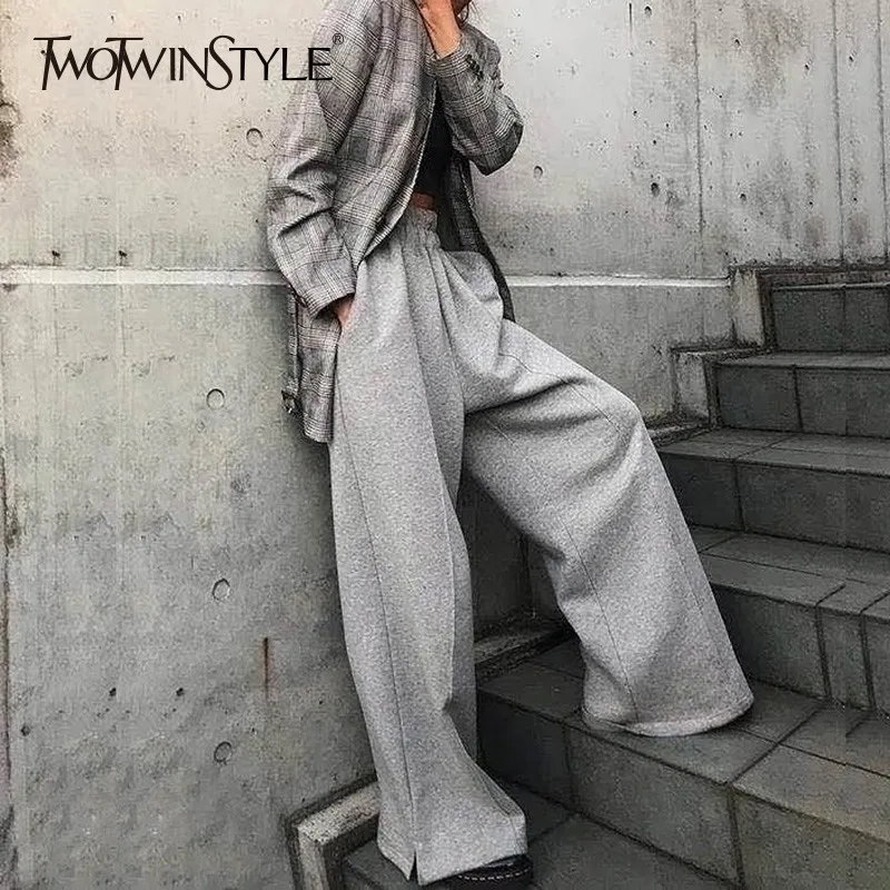 TWOTWINSTYLE корейские широкие брюки для женщин с высокой талией и эластичными пуговицами, серые женские брюки с разрезом, плотные 2022 на весну и зиму
TWOTWINSTYLE корейские широкие брюки для женщин с высокой талией и эластичными пуговицами, серые женские брюки с разрезом, плотные 2022 на весну и зиму
