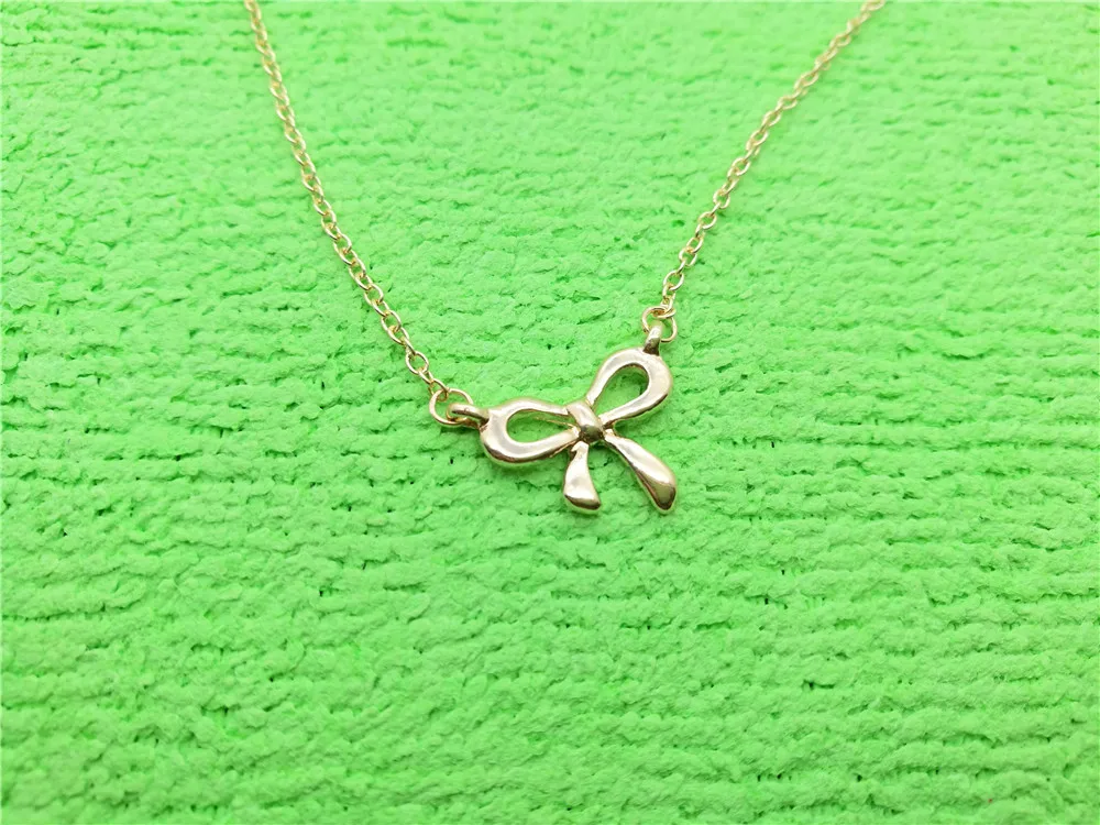 Cute and compact Bow Necklace for Women's Wedding Lucky Blessing hollow bow-knot small rosette pendant Necklace Jewelry
Cute and compact Bow Necklace for Women's Wedding Lucky Blessing hollow bow-knot small rosette pendant Necklace Jewelry