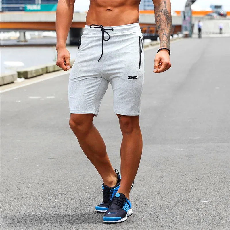 Mens cotton shorts Calf-Length gyms Fitness Bodybuilding Casual Joggers workout Brand sporting short pants Sweatpants Sportswear 
Mens cotton shorts Calf-Length gyms Fitness Bodybuilding Casual Joggers workout Brand sporting short pants Sweatpants Sportswear