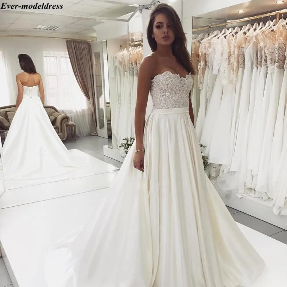 Satin Simple Wedding Dresses 2019 Lace Appliques Sweetheart Lace Up Back Sweep Train Gorgeous Bridal Gowns Robe De Mariee Cheap
Satin Simple Wedding Dresses 2019 Lace Appliques Sweetheart Lace Up Back Sweep Train Gorgeous Bridal Gowns Robe De Mariee Cheap