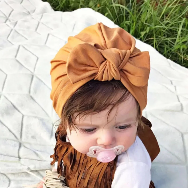 Фото Однотонные шапки с бантиком для маленьких девочек хлопковая - купить