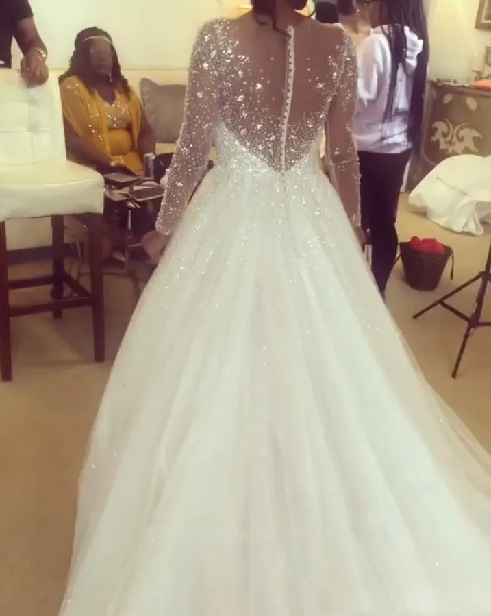 2020 Sheer Jewel Neck Boho Wedding Dress Long Sleeves Shiny Beaded Crystals Wedding Bride Dress Hippie Abiti da sposa mariage
2020 Sheer Jewel Neck Boho Wedding Dress Long Sleeves Shiny Beaded Crystals Wedding Bride Dress Hippie Abiti da sposa mariage
