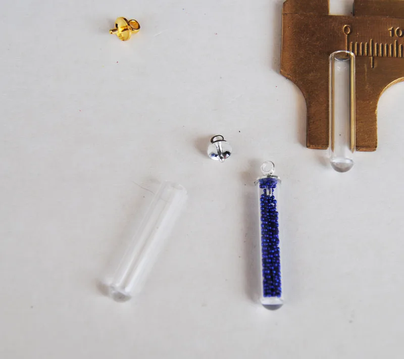 New 100sets/lot 25*5mm tube glass globe & 5mm cap cover button set (no filler) glass bottle sweater chain
New 100sets/lot 25*5mm tube glass globe & 5mm cap cover button set (no filler) glass bottle sweater chain