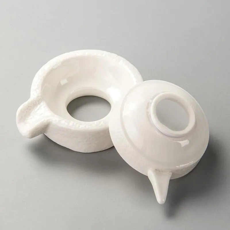 Stone mill tea leaking white porcelain tea filter ceramic Kung Fu tea set accessories creative tea strainer
Stone mill tea leaking white porcelain tea filter ceramic Kung Fu tea set accessories creative tea strainer