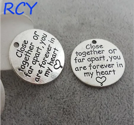 Top Quality 5 Pieces/lot 25mm Letter Printed close together or far apart you are forever in my heart round disc message charm
Top Quality 5 Pieces/lot 25mm Letter Printed close together or far apart you are forever in my heart round disc message charm