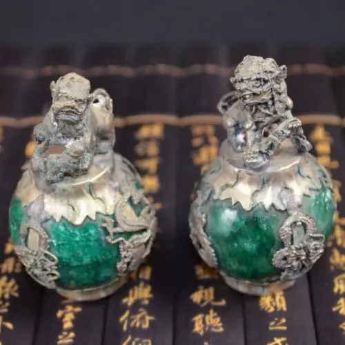 A Pair of Antique collection old Tibetan Silver Lion Package Imitation Green Jade Statue
A Pair of Antique collection old Tibetan Silver Lion Package Imitation Green Jade Statue