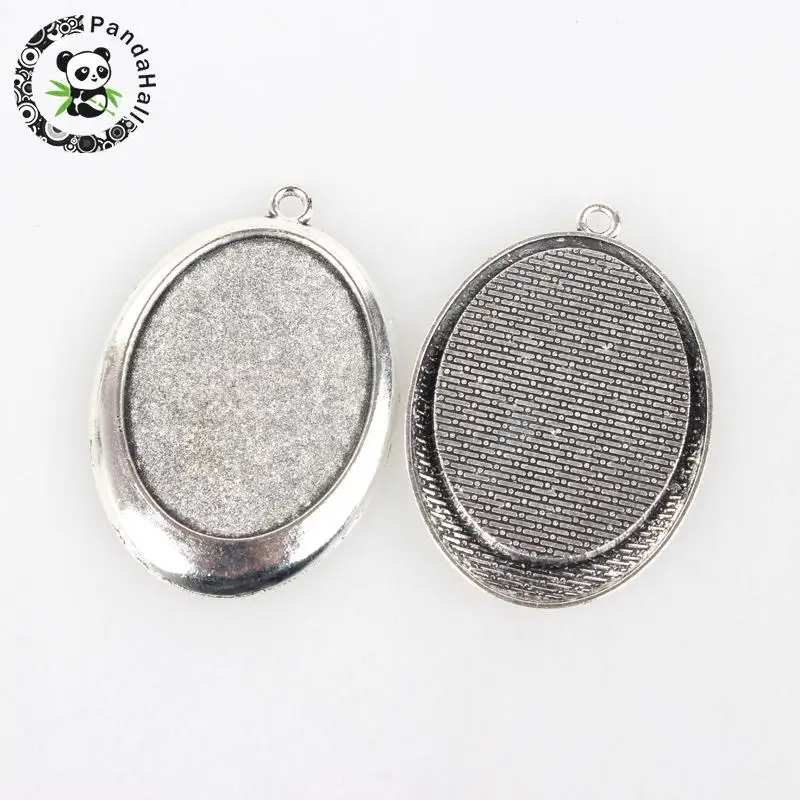 Tibetan Style Alloy Pendant Cabochon Settings, Oval, Antique Silver Color, Tray: 30x40mm; 55x38x3mm, Hole: 3mm
Tibetan Style Alloy Pendant Cabochon Settings, Oval, Antique Silver Color, Tray: 30x40mm; 55x38x3mm, Hole: 3mm