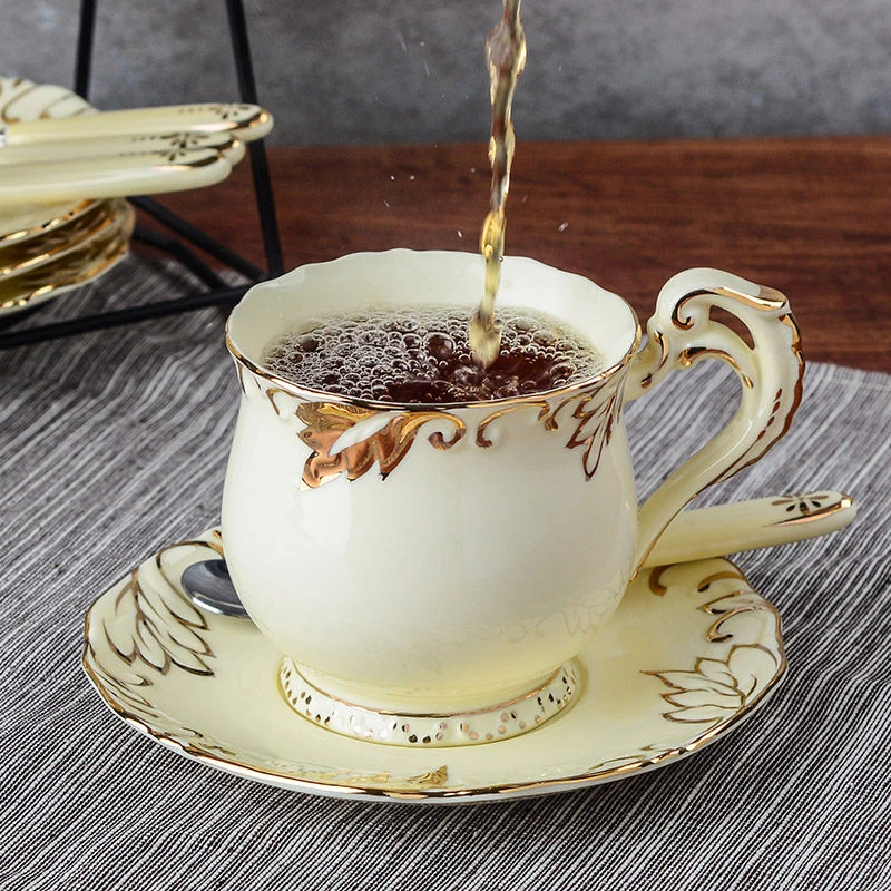 European Coffee Cup and Saucer set British Ivory Ceramic Coffee Cups Set Advanced Bone China gifts Cup and Spoon Saucer
European Coffee Cup and Saucer set British Ivory Ceramic Coffee Cups Set Advanced Bone China gifts Cup and Spoon Saucer