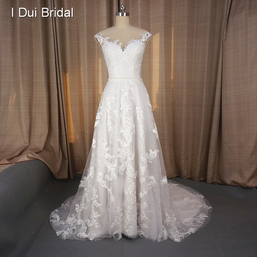 Cap Sleeve Illusion Nude Tulle Neckline A line Lace Wedding Dresses Real Photo Custom Made New Style Bridal Gown with Pearl Belt
Cap Sleeve Illusion Nude Tulle Neckline A line Lace Wedding Dresses Real Photo Custom Made New Style Bridal Gown with Pearl Belt