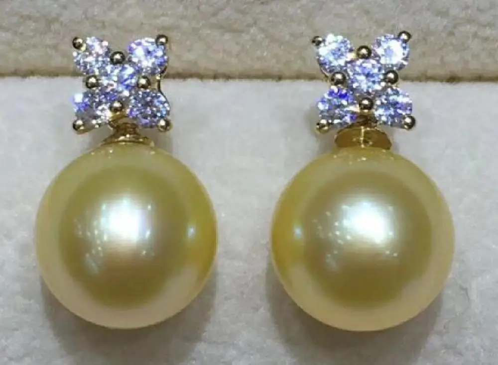 AAA 10-11 mm round natural south sea gold pearl earrings 14 K yellow gold
AAA 10-11 mm round natural south sea gold pearl earrings 14 K yellow gold
