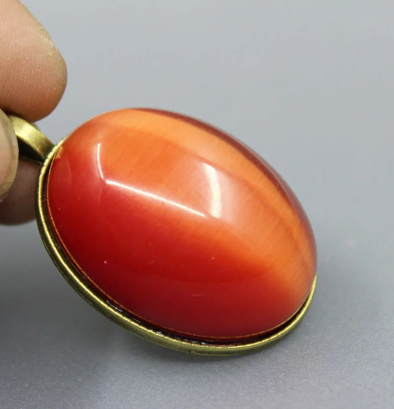 Natural handmade orange cat eye pendant Women men's Amulet Jewelry free shipping
Natural handmade orange cat eye pendant Women men's Amulet Jewelry free shipping