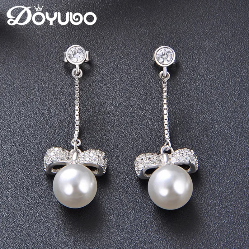 DOYUBO Elegant Women's 8MM Simulated Pearl Earrings 925 Sterling Silver Bowknot Cubic Zircon Drop Earrings Fashion Jewelry VC209
DOYUBO Elegant Women's 8MM Simulated Pearl Earrings 925 Sterling Silver Bowknot Cubic Zircon Drop Earrings Fashion Jewelry VC209