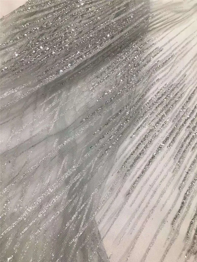 Silver color H-1951117 african tulle mesh fabric sparkly glued glitter sequins lace fabric for show or wedding dress
Silver color H-1951117 african tulle mesh fabric sparkly glued glitter sequins lace fabric for show or wedding dress