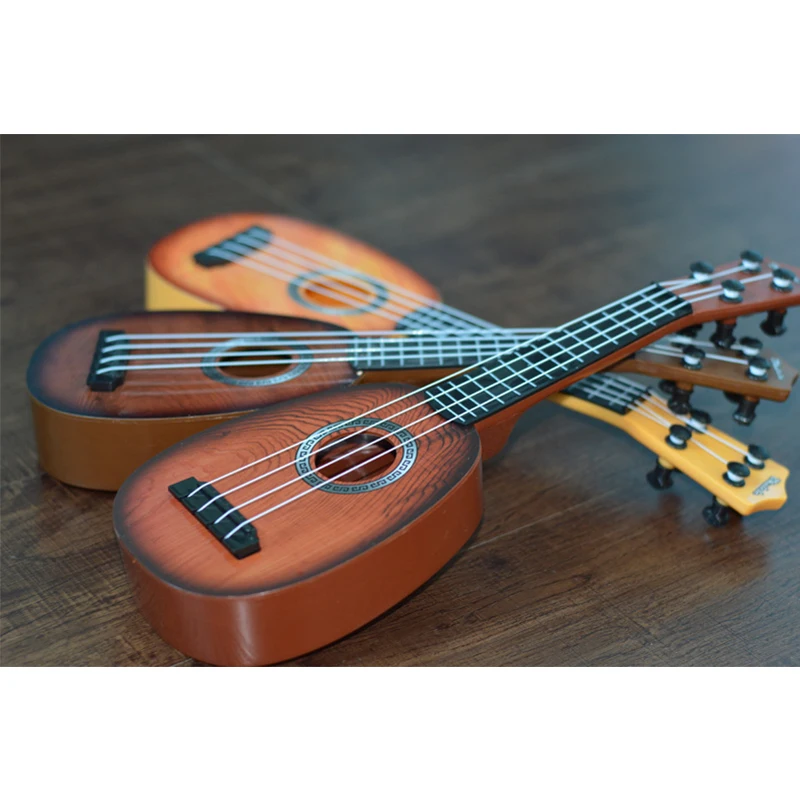 Fashion Children Music Educational Guitar Toy Plastic Musical Instruments Mini Guitar Learning Music UkuleleToy For Kids
Fashion Children Music Educational Guitar Toy Plastic Musical Instruments Mini Guitar Learning Music UkuleleToy For Kids