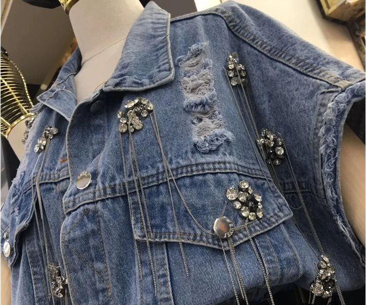 High Quality New Women Luxury Diamond Sequined Denim Vest Spring Summer Ripped Holes Tassels Loose Coat female Jeans Vest CC198
High Quality New Women Luxury Diamond Sequined Denim Vest Spring Summer Ripped Holes Tassels Loose Coat female Jeans Vest CC198