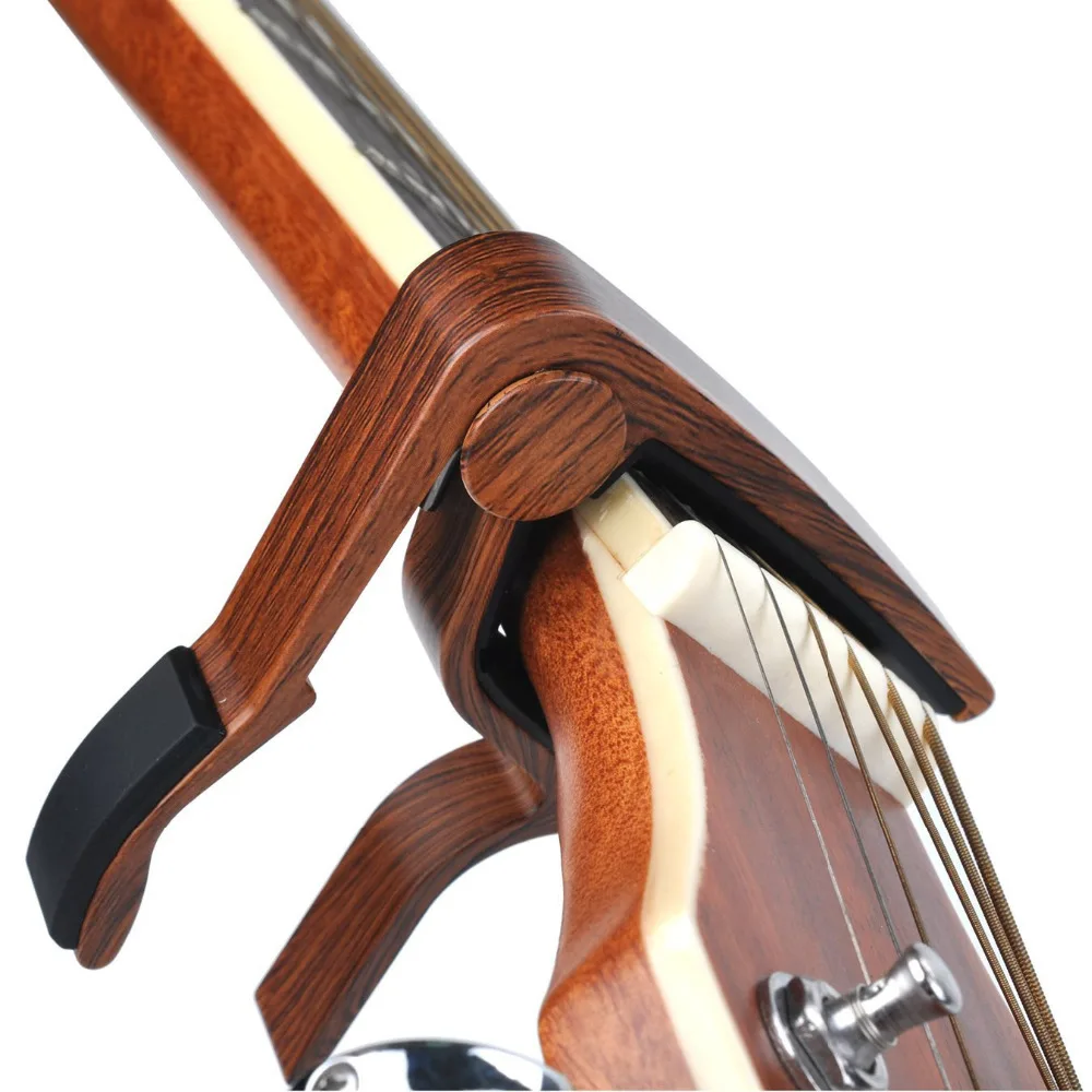 Electric Acoustic Guitar Bass Violin Ukulele Capo Single-handed Tune Clamp Wood Color Aluminum Alloy Guitar Capo
Electric Acoustic Guitar Bass Violin Ukulele Capo Single-handed Tune Clamp Wood Color Aluminum Alloy Guitar Capo
