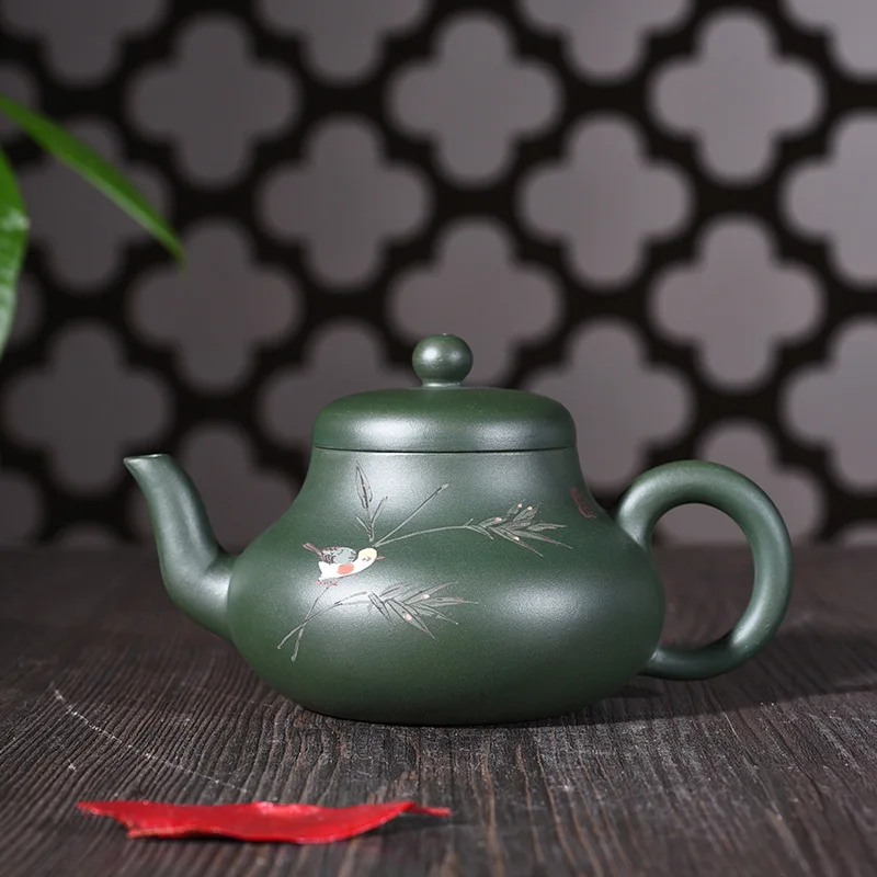 Yixing purple clay pot genuine hand-made raw ore green mud painting Siting pot Kungfu Teapot Set wholesale
Yixing purple clay pot genuine hand-made raw ore green mud painting Siting pot Kungfu Teapot Set wholesale
