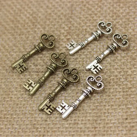 Брелоки в форме ключа, два цвета, винтажный металлический сплав цинка, изысканные трендовые брелоки для украшений, 50 шт./лот, 10*29 мм
Брелоки в форме ключа, два цвета, винтажный металлический сплав цинка, изысканные трендовые брелоки для украшений, 50 шт./лот, 10*29 мм