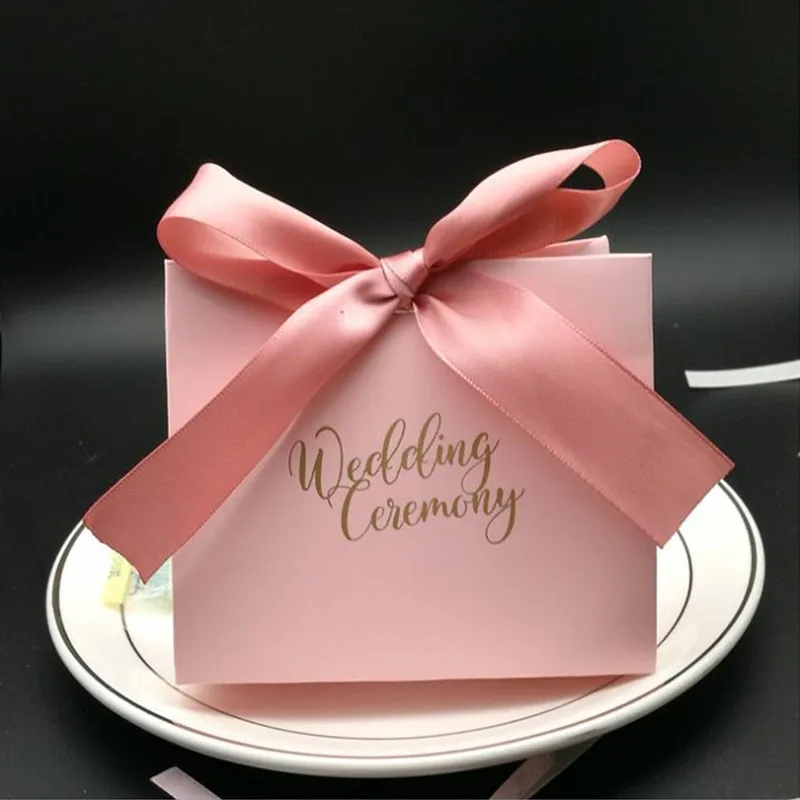 50pcs Simple pink sweet romantic wedding candy box with ribbon wedding party decoration pink with hand chocolate gift box
50pcs Simple pink sweet romantic wedding candy box with ribbon wedding party decoration pink with hand chocolate gift box