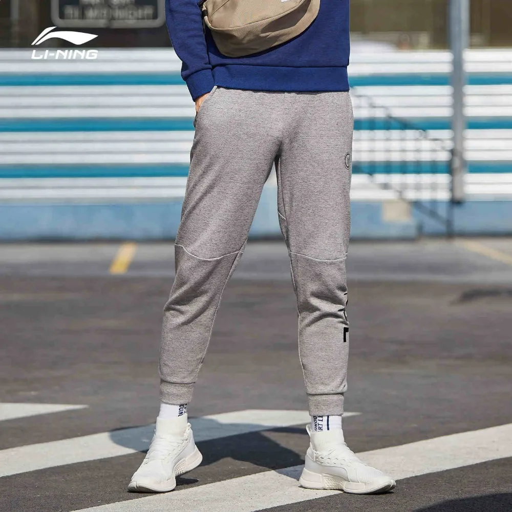 Li-Ning мужские спортивные штаны серии Уэйд 82% хлопок 18% полиэстер обычная посадка на