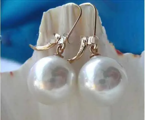 

Free shipping Details about natural huge 10-11mm AAA++south sea round gold pearl dangle earrings