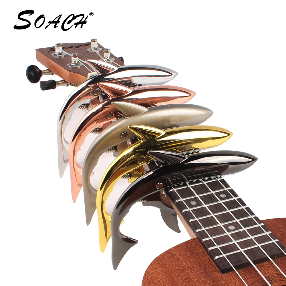 The new wooden folk Guitar capo Sharks clip diacritical transponders capo guitar accessories sound clips
The new wooden folk Guitar capo Sharks clip diacritical transponders capo guitar accessories sound clips