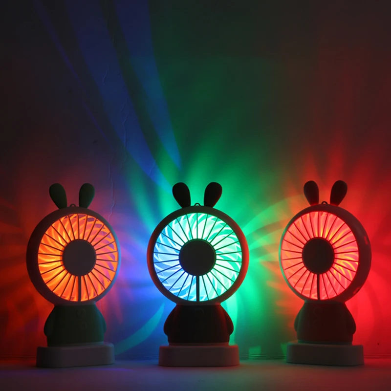 Hot Sale Portable Rechargeable Mini Hand Fan For Travelling Outdoor Office Creative Cooling Fan with Colorful Led Night Light
Hot Sale Portable Rechargeable Mini Hand Fan For Travelling Outdoor Office Creative Cooling Fan with Colorful Led Night Light