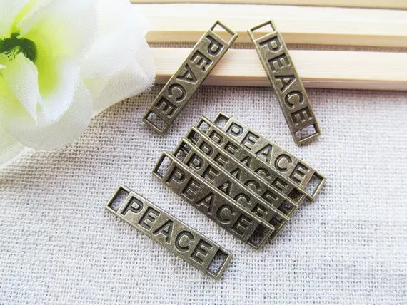 30pcs Antique silver tone/Antique Bronze Sideway "PEACE" Connector Pendant Charm/Finding,Bracelet Charm,DIY Accessory Jewelry
30pcs Antique silver tone/Antique Bronze Sideway "PEACE" Connector Pendant Charm/Finding,Bracelet Charm,DIY Accessory Jewelry