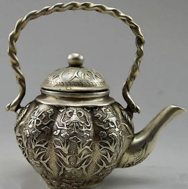 Продуманный китайский ручной заварочный чайник в виде старого тибетского Серебряного Цветка рыбы 
Продуманный китайский ручной заварочный чайник в виде старого тибетского Серебряного Цветка рыбы