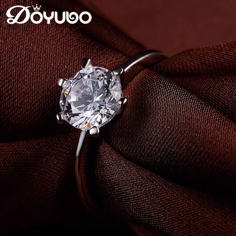 Классическое женское однотонное серебряное кольцо DOYUBO с 6 мм белым кубическим цирконием высококачественные серебряные кольца Изящные Ювел...
Классическое женское однотонное серебряное кольцо DOYUBO с 6 мм белым кубическим цирконием высококачественные серебряные кольца Изящные Ювел...