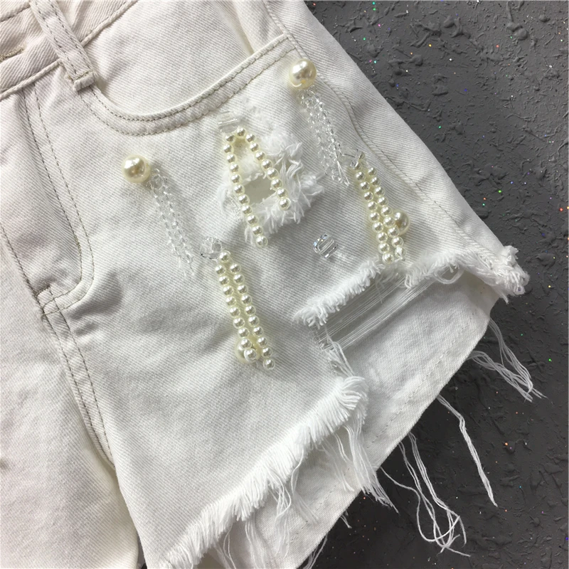 New short Jeans Shorts Women Summer New European Station Hole Nail Pearl High Waist Slim Fashion Fur edged Broad legged Hot
New short Jeans Shorts Women Summer New European Station Hole Nail Pearl High Waist Slim Fashion Fur edged Broad legged Hot