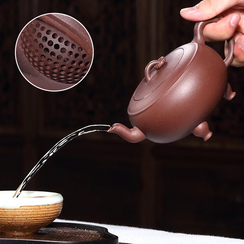 330ml Yixing Zisha Ore Mud Full Hand Tea Pot High Teapot 188 Ball Hole Tea Pot Kung Fu Tea Set Three Feet Tripod Tripod Kettle
330ml Yixing Zisha Ore Mud Full Hand Tea Pot High Teapot 188 Ball Hole Tea Pot Kung Fu Tea Set Three Feet Tripod Tripod Kettle