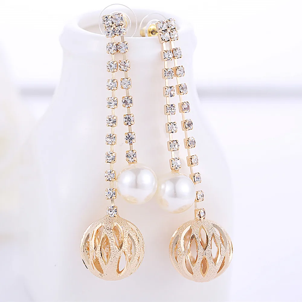 New Big Pattern Hollow Long Earrings Women Fashion Jewelry White AAA Zircon Carved Unique Ball Earrings E00947
New Big Pattern Hollow Long Earrings Women Fashion Jewelry White AAA Zircon Carved Unique Ball Earrings E00947