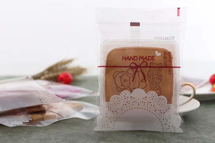 100pcs Lovely Lace Bow Print Gifts Self-adhesive Bags Christmas Party Cookie Plastic Bags for Biscuits Candy Cake Package
100pcs Lovely Lace Bow Print Gifts Self-adhesive Bags Christmas Party Cookie Plastic Bags for Biscuits Candy Cake Package